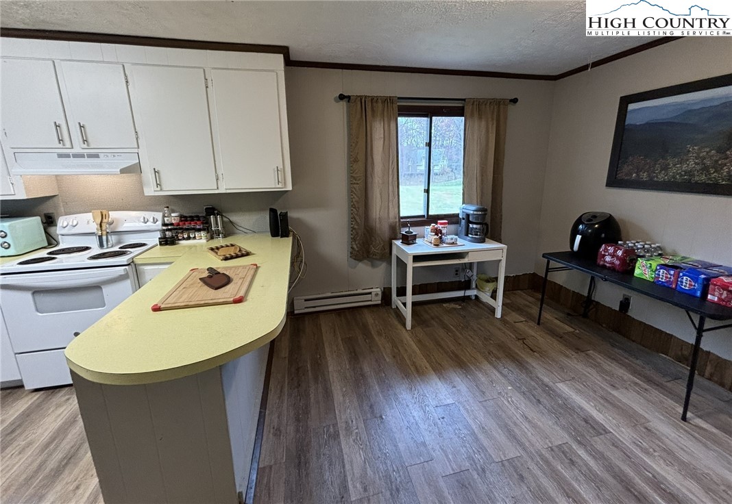224 Alex Wellborn Road Deep Gap, NC 28618 - Photo 13 of 26 a work place with furniture and wooden floor