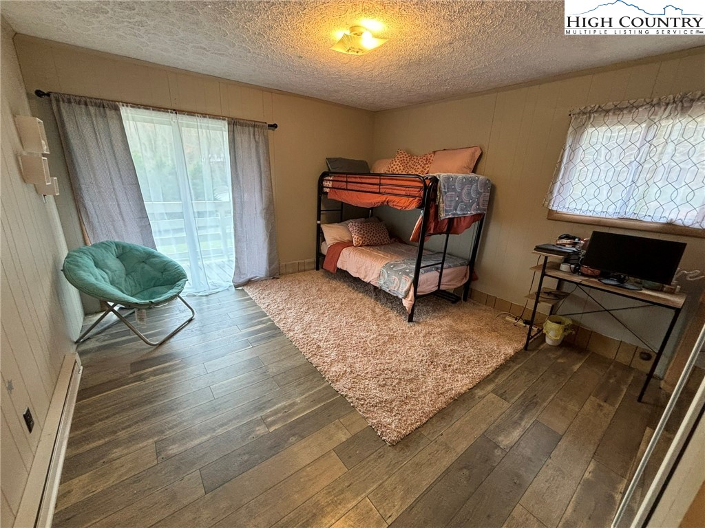 224 Alex Wellborn Road Deep Gap, NC 28618 - Photo 19 of 26 a living room with furniture and a window