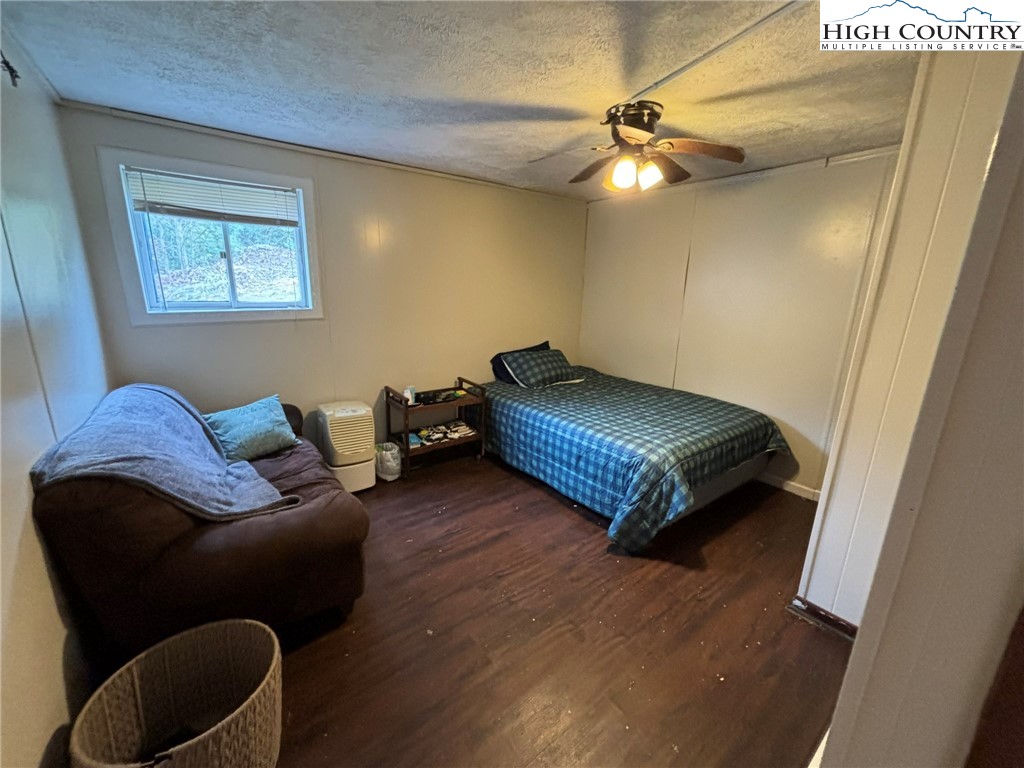 224 Alex Wellborn Road Deep Gap, NC 28618 - Photo 25 of 26 a living room with furniture and a ceiling fan