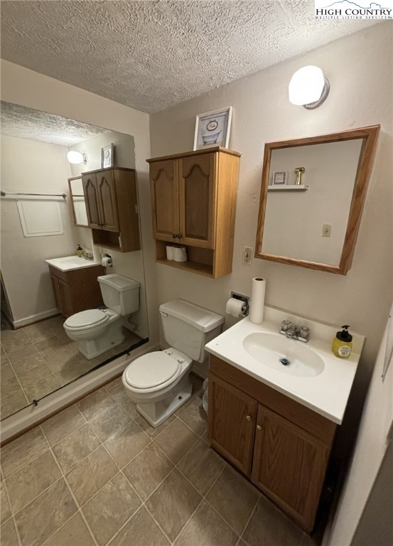 224 Alex Wellborn Road Deep Gap, NC 28618 - Photo 26 of 26 a bathroom with a double vanity sink and mirror
