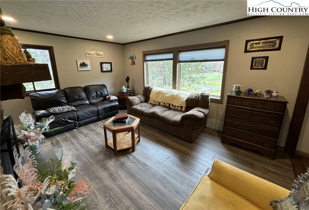 224 Alex Wellborn Road Deep Gap, NC 28618 - Photo 7 of 26 a living room with furniture and a large window