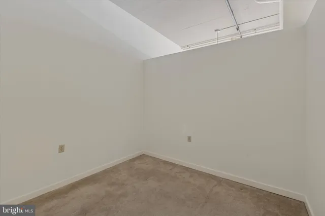 a view of a building with potted plants and more windows