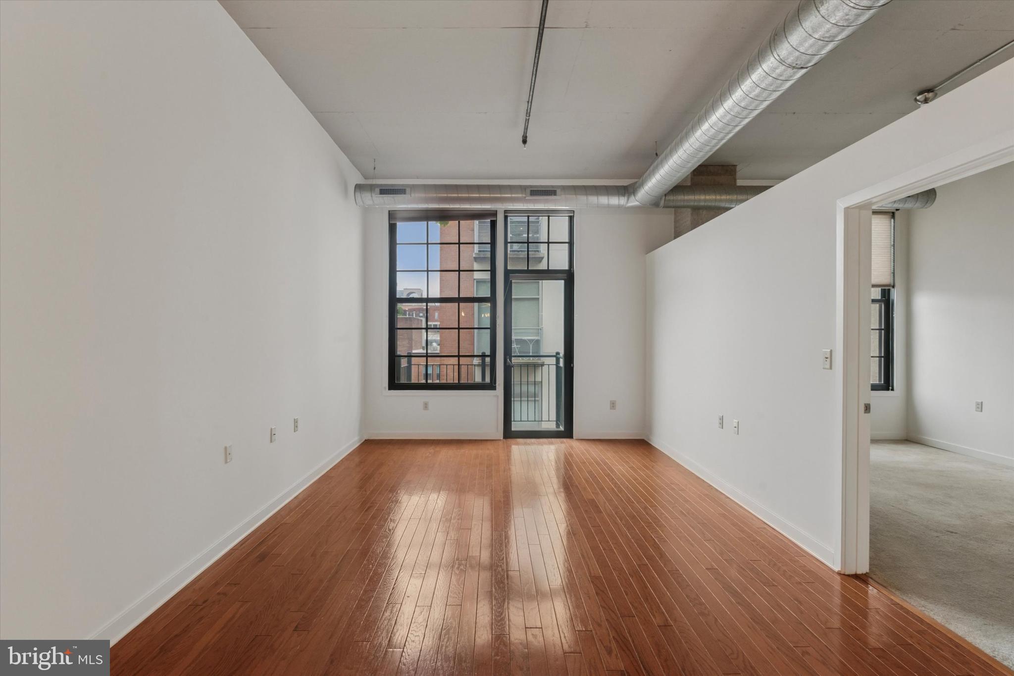 112 North 2nd Street, Unit 5F5 Philadelphia, PA 19106 - Photo 15 of 16 wooden floor in an empty room with a window