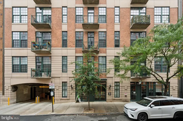 a view of a car parked in front of a building
