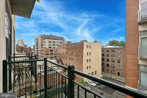 a view of a balcony with city view