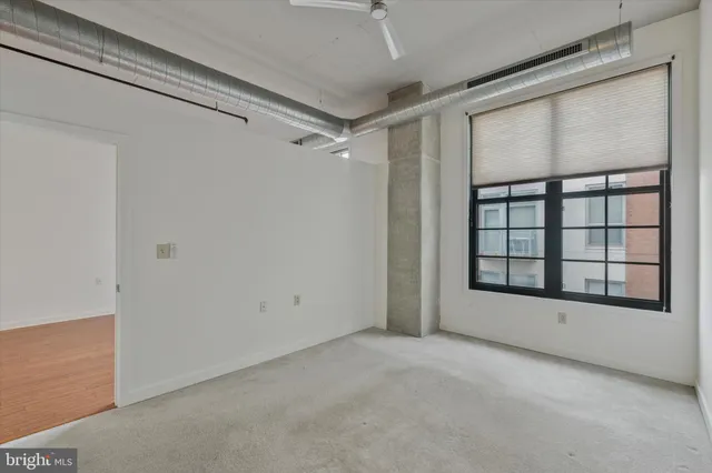 a view of an empty room with a window