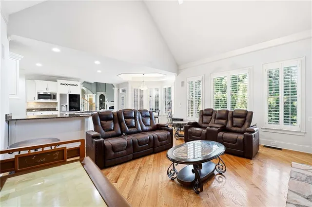 a bathroom with a sink a mirror and shower
