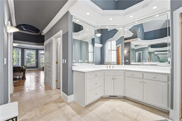 a view of walk in closet with clothes