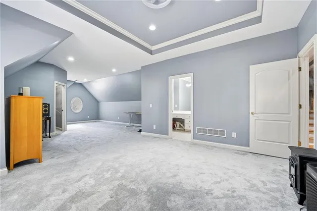 a bathroom with a tub a sink and mirror