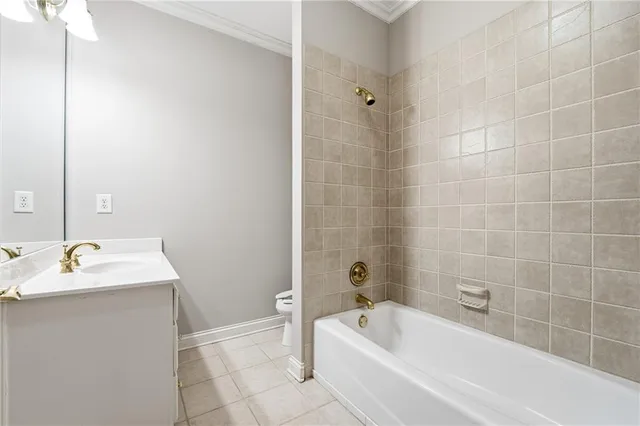 a bathroom with a sink mirror and shower