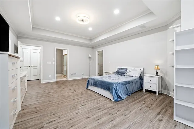 a view of a big house with a big yard and large trees