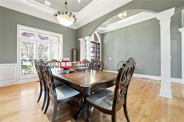 a view of a dining room with furniture window and wooden floor
