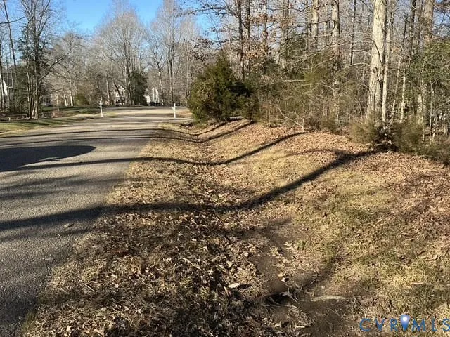 a view of house with yard