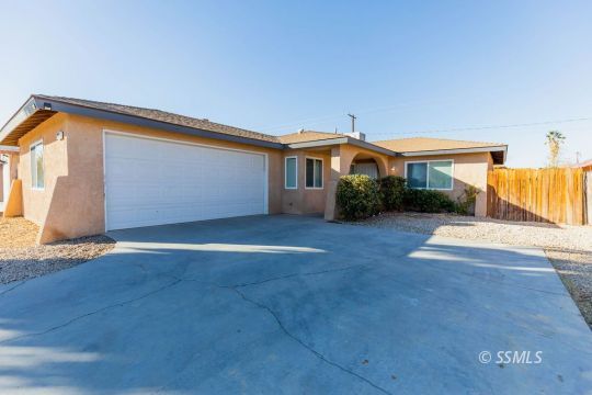 929 South Ranger Street Ridgecrest, CA 93555 - Photo 3 of 25 a view of a house with a yard