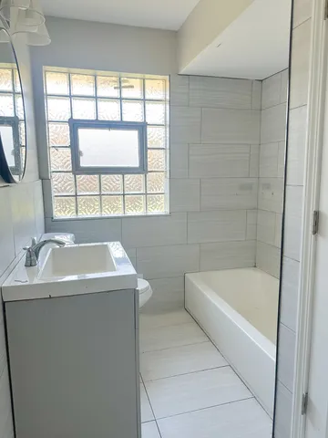 a bathroom with a sink and a bathtub