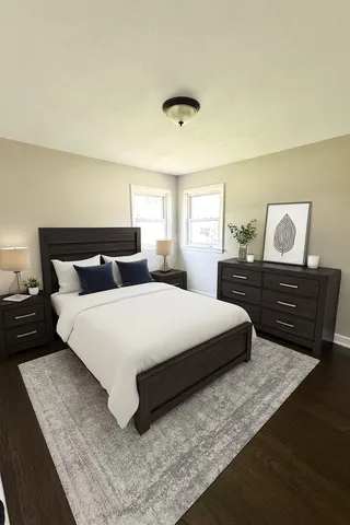 a bedroom with a bed and window