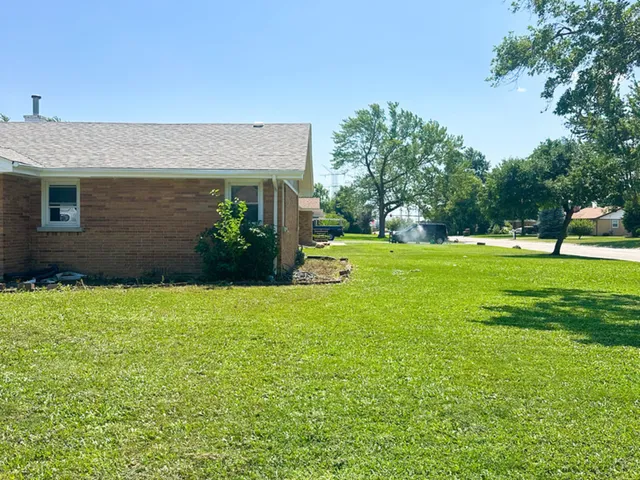 a backyard of a house with lots of green space