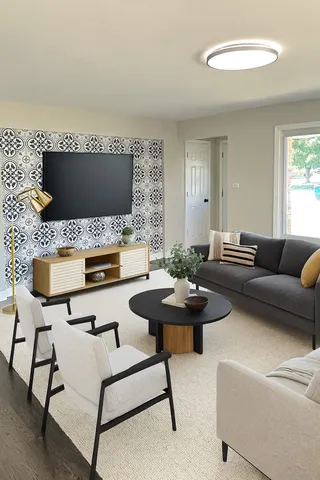 a living room with furniture and a flat screen tv