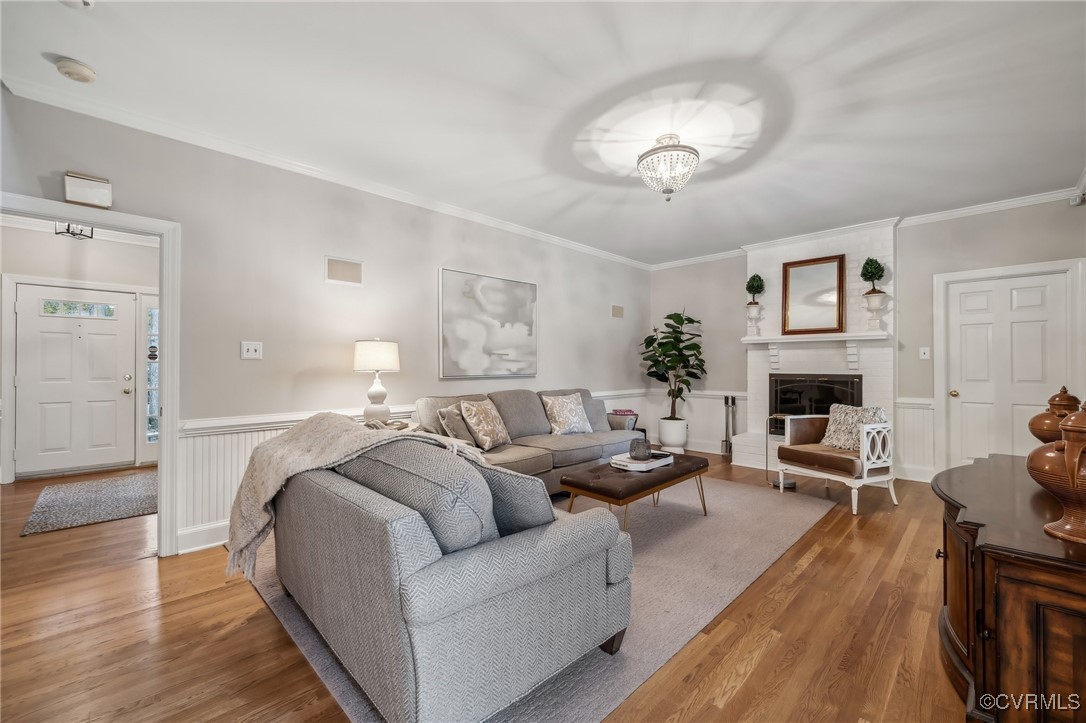 12802 Craystone Circle Midlothian, VA 23113 - Photo 19 of 50 a living room with furniture a fireplace and a chandelier