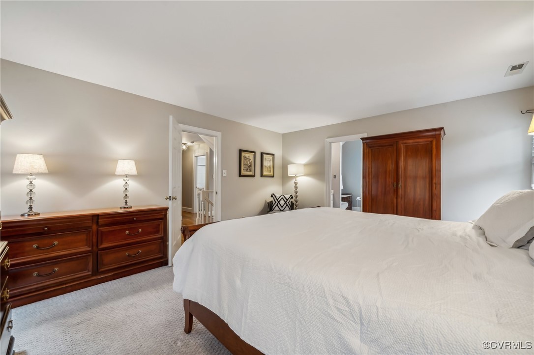 12802 Craystone Circle Midlothian, VA 23113 - Photo 28 of 50 a spacious bedroom with a bed and a dresser