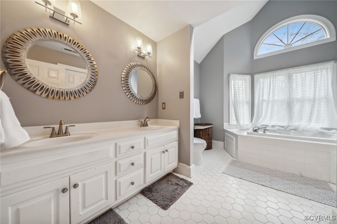 12802 Craystone Circle Midlothian, VA 23113 - Photo 29 of 50 a spacious bathroom with a double vanity sink and a mirror