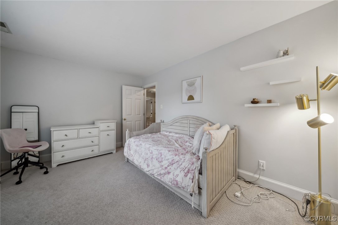 12802 Craystone Circle Midlothian, VA 23113 - Photo 36 of 50 a bedroom with a bed and a chair in it