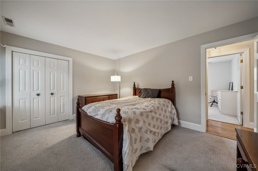 12802 Craystone Circle Midlothian, VA 23113 - Photo 37 of 50 a spacious bedroom with a bed and walk in closet
