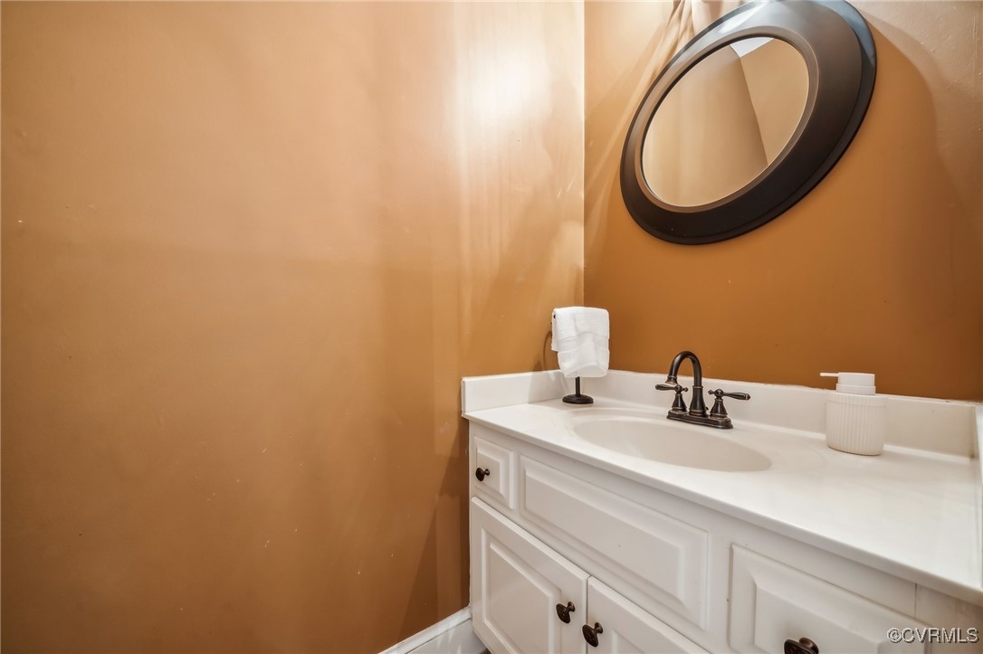 12802 Craystone Circle Midlothian, VA 23113 - Photo 42 of 50 a bathroom with a sink and a mirror