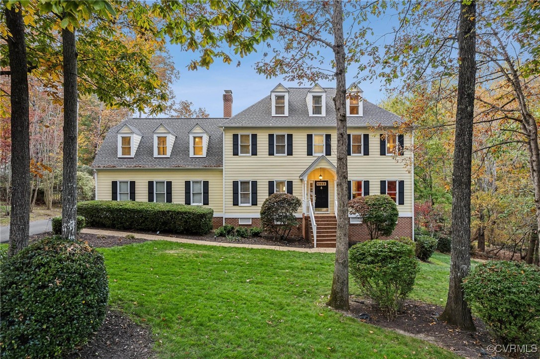 12802 Craystone Circle Midlothian, VA 23113 - Photo 48 of 50 a front view of a house with a garden and trees
