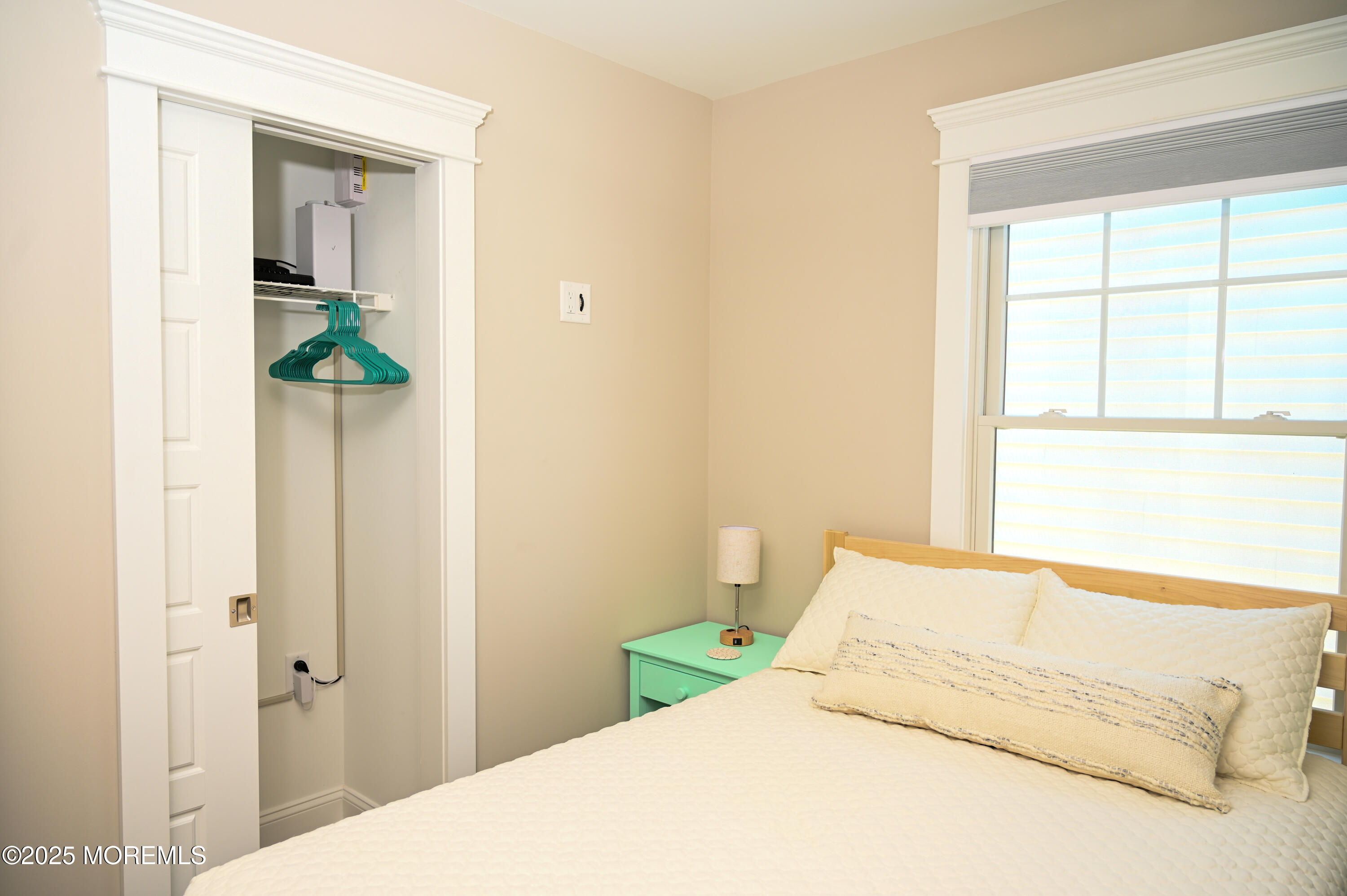 8 Shell Road Mantoloking, NJ 08738 - Photo 11 of 29 a bedroom with a bed and a window