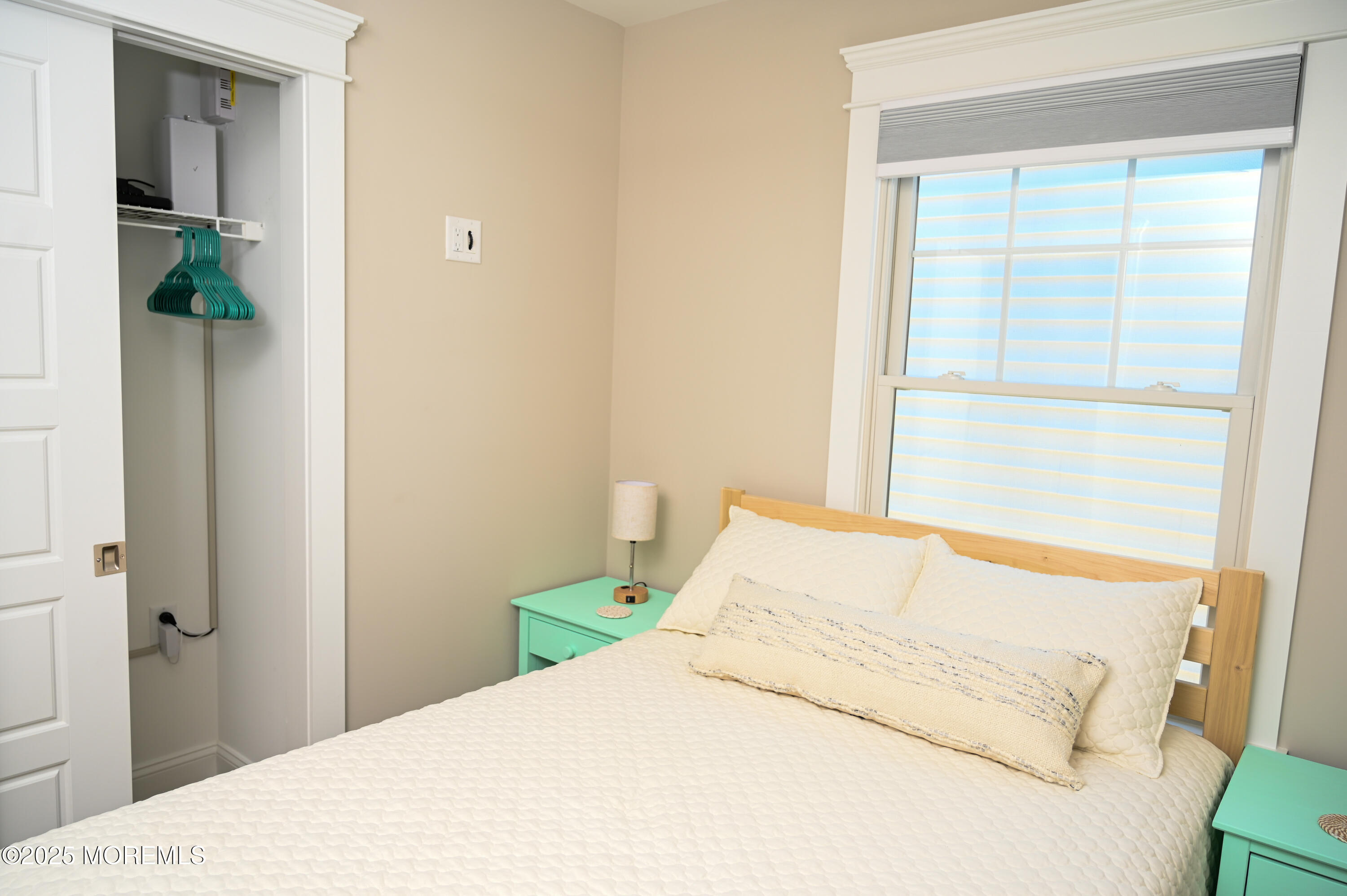 8 Shell Road Mantoloking, NJ 08738 - Photo 12 of 29 a bedroom with a bed and a window