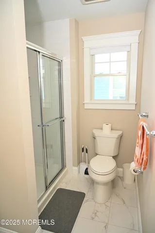 a bathroom with a sink vanity and mirror
