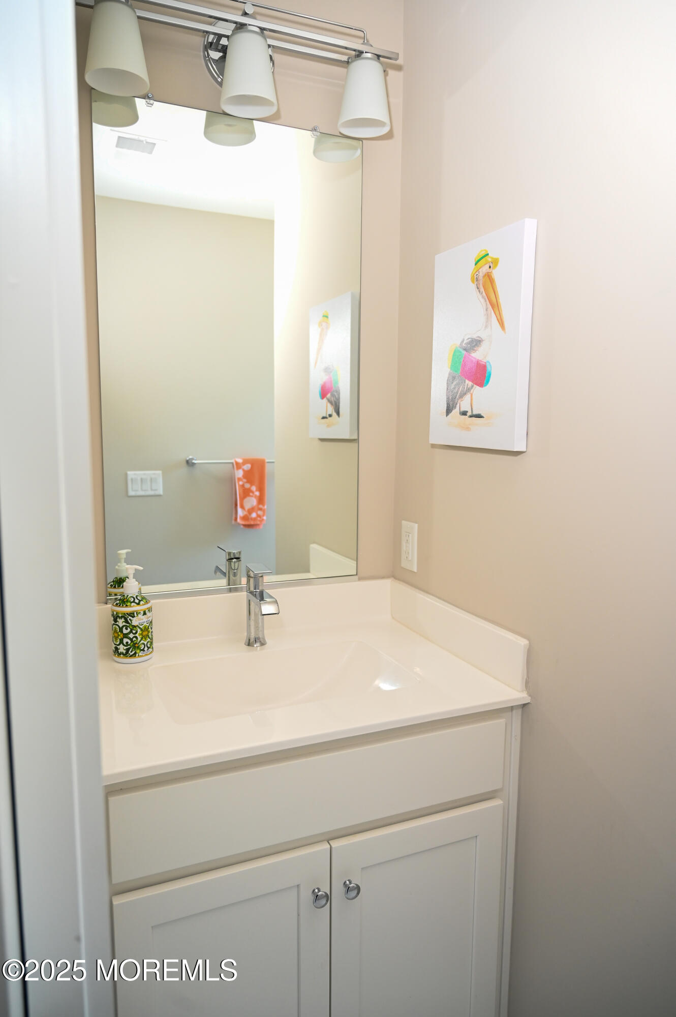 8 Shell Road Mantoloking, NJ 08738 - Photo 20 of 29 a bathroom with a sink vanity and mirror