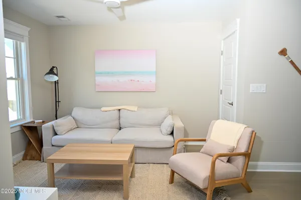 a living room with furniture and a blue chair