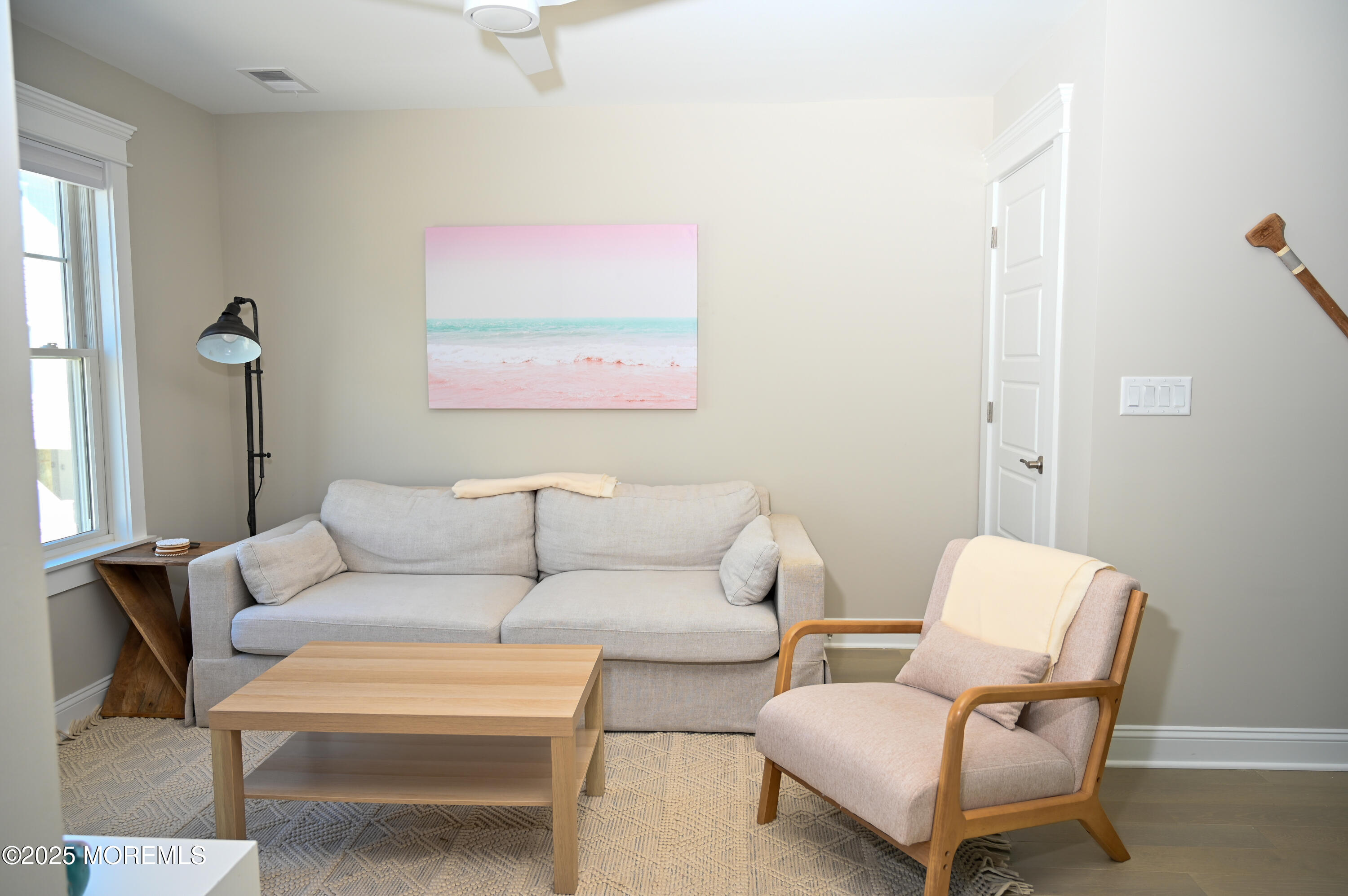 8 Shell Road Mantoloking, NJ 08738 - Photo 2 of 29 a living room with furniture and a blue chair