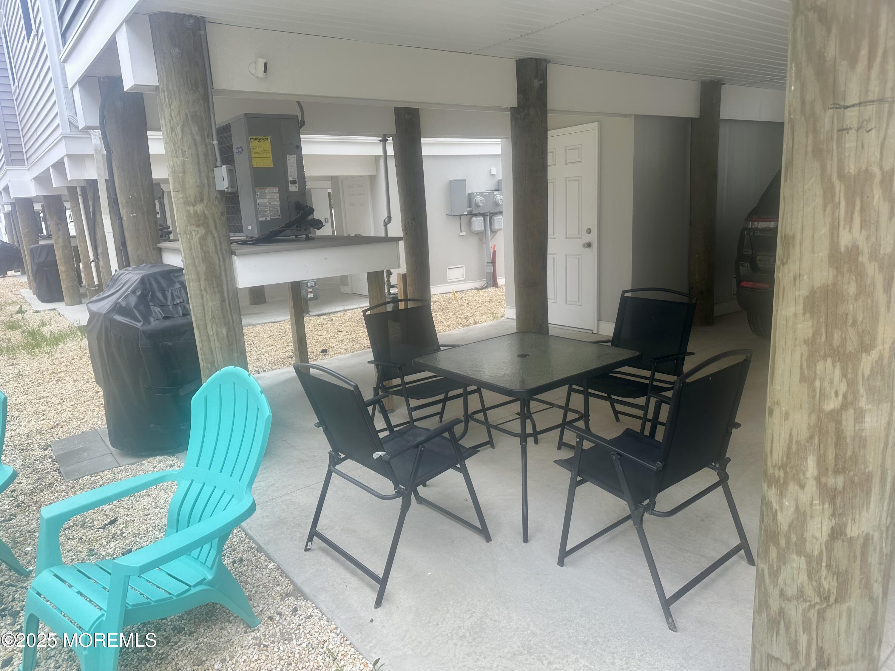 8 Shell Road Mantoloking, NJ 08738 - Photo 22 of 29 a view of a dining room with furniture and a chandelier