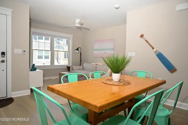a view of a dining room with furniture and window