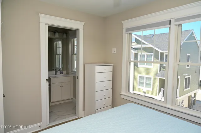 a bedroom with a bed and a cabinets