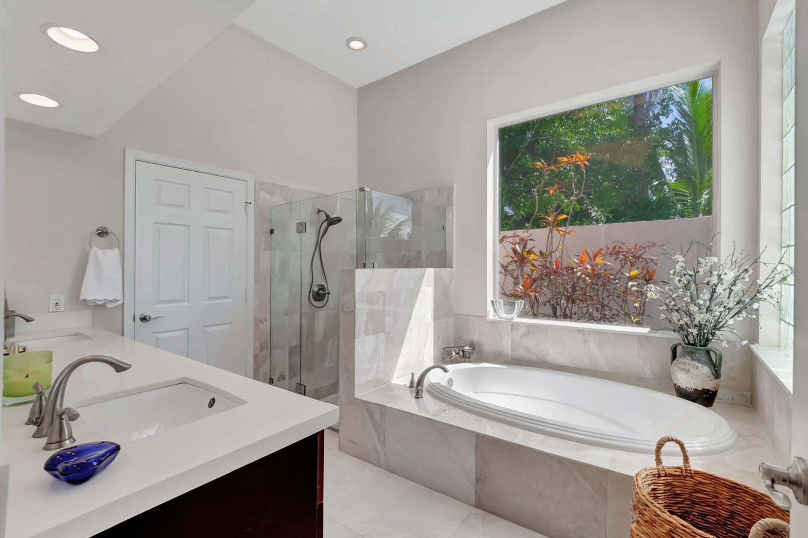 6096 Northwest 30th Way Boca Raton, FL 33496 - Photo 11 of 24 a bathroom with a tub sink and mirror