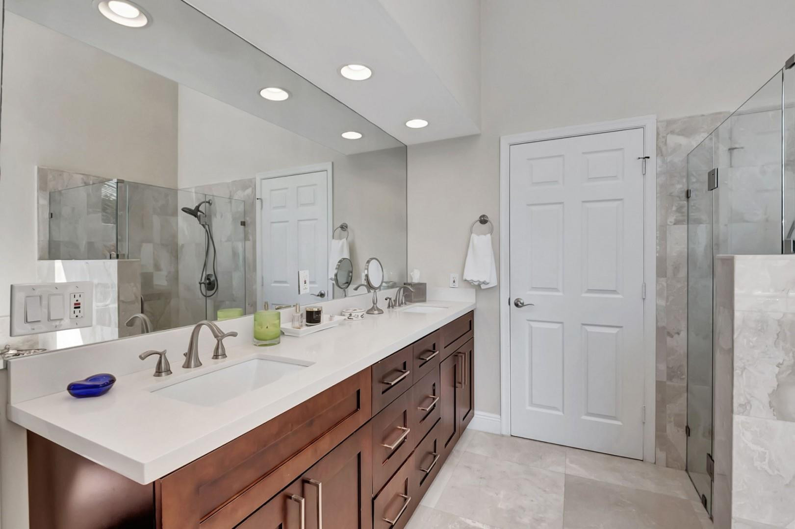 6096 Northwest 30th Way Boca Raton, FL 33496 - Photo 12 of 24 a bathroom with a sink double vanity granite tub shower and a mirror