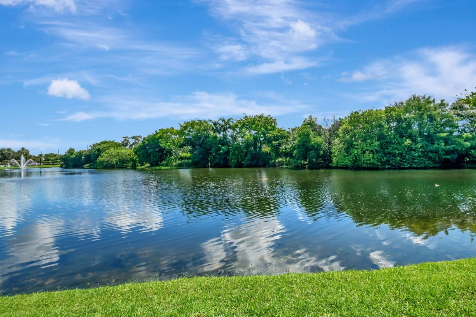 6096 Northwest 30th Way Boca Raton, FL 33496 - Photo 21 of 24 a view of a lake with houses in the back