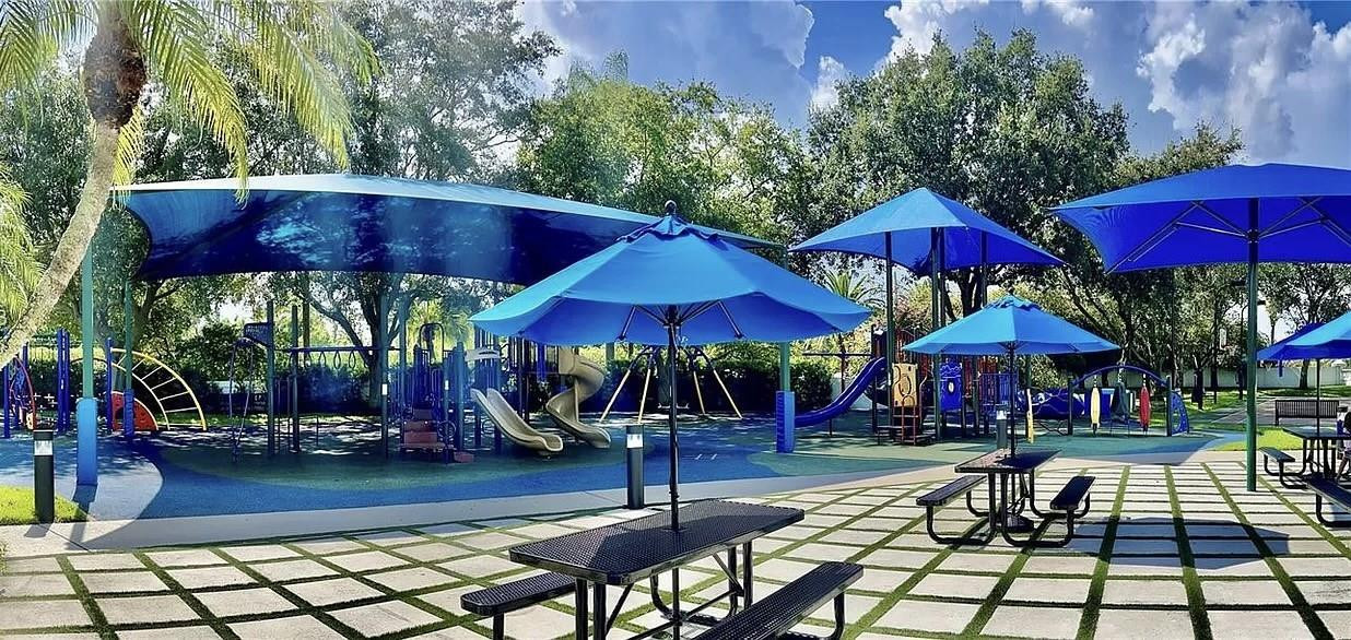 6096 Northwest 30th Way Boca Raton, FL 33496 - Photo 23 of 24 a view of patio with chairs and umbrella