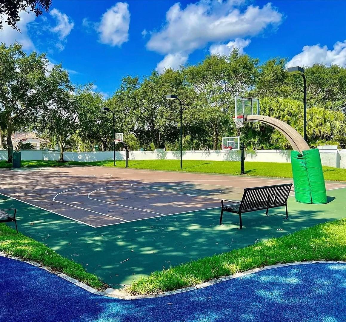 6096 Northwest 30th Way Boca Raton, FL 33496 - Photo 24 of 24 a view of a park with swings and slides