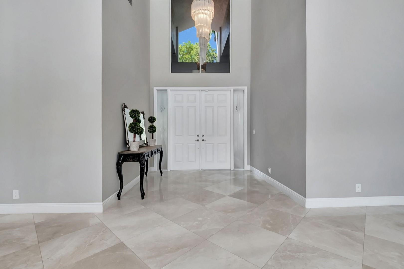 6096 Northwest 30th Way Boca Raton, FL 33496 - Photo 3 of 24 a view of entryway with wooden floor