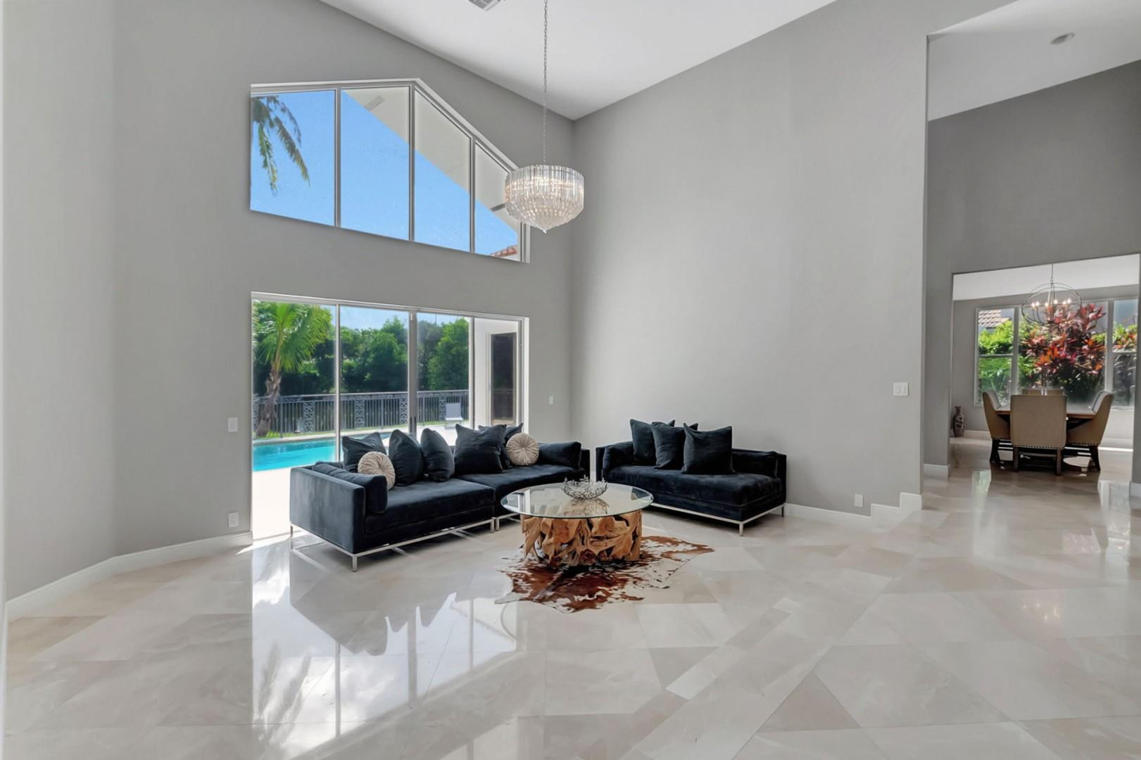 6096 Northwest 30th Way Boca Raton, FL 33496 - Photo 4 of 24 a living room with furniture and a large window