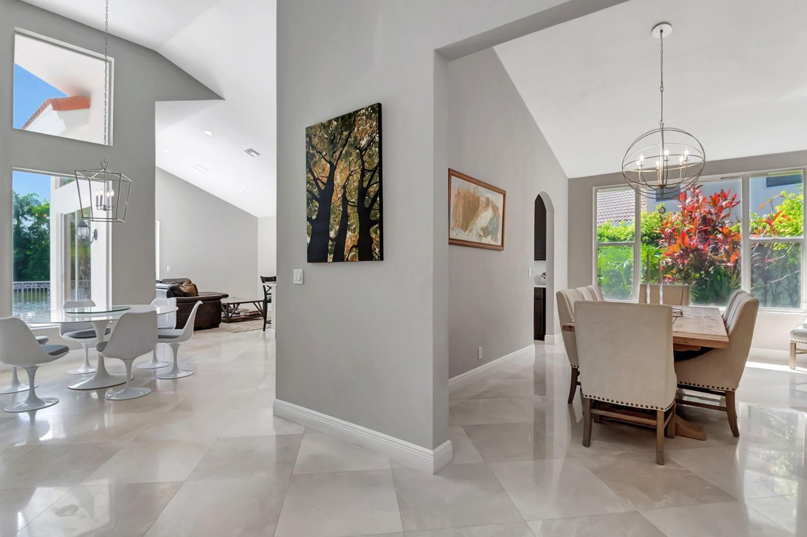 6096 Northwest 30th Way Boca Raton, FL 33496 - Photo 6 of 24 a view of a dining room with furniture and a chandelier