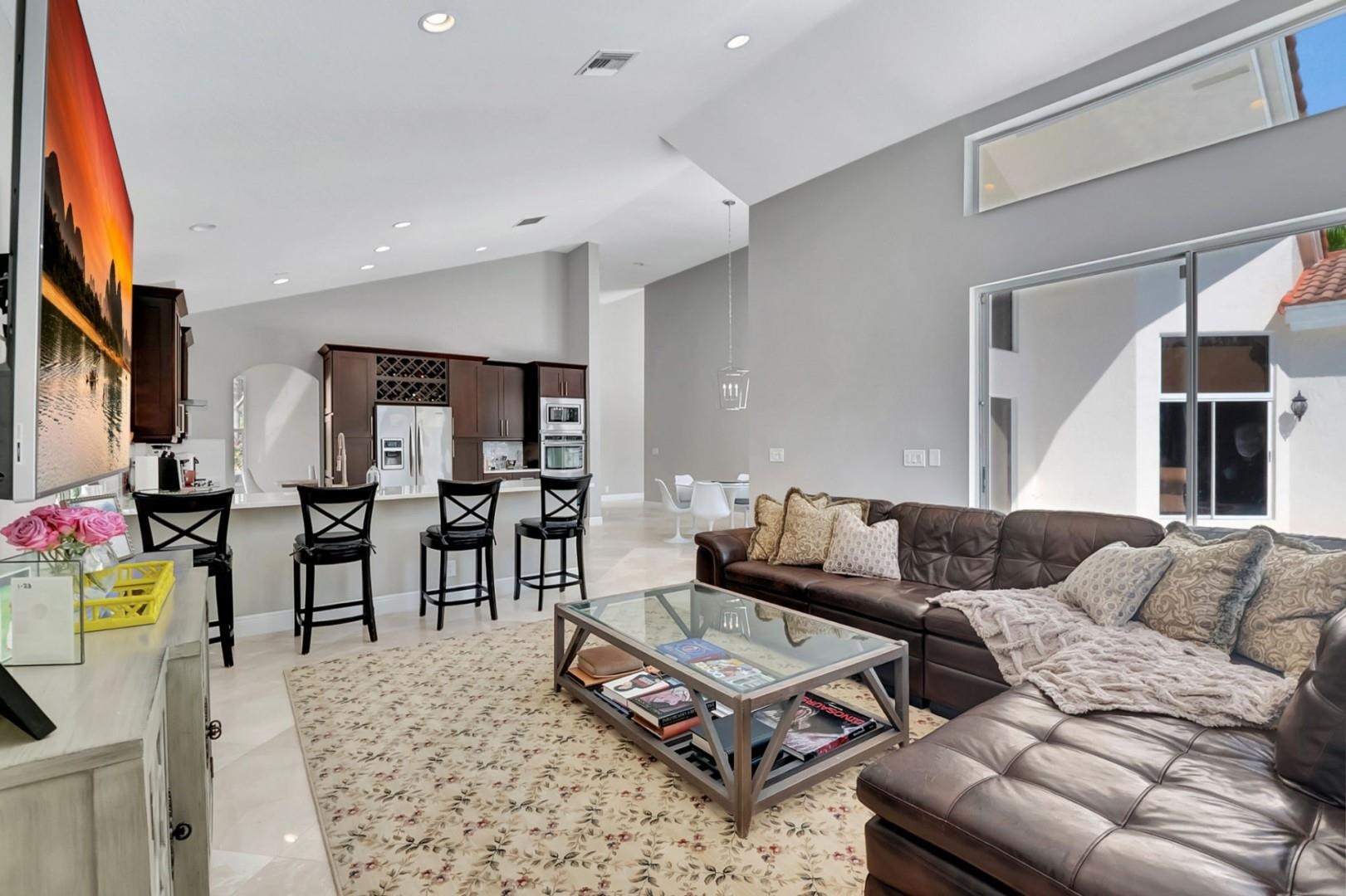 6096 Northwest 30th Way Boca Raton, FL 33496 - Photo 9 of 24 a living room with furniture and wooden floor