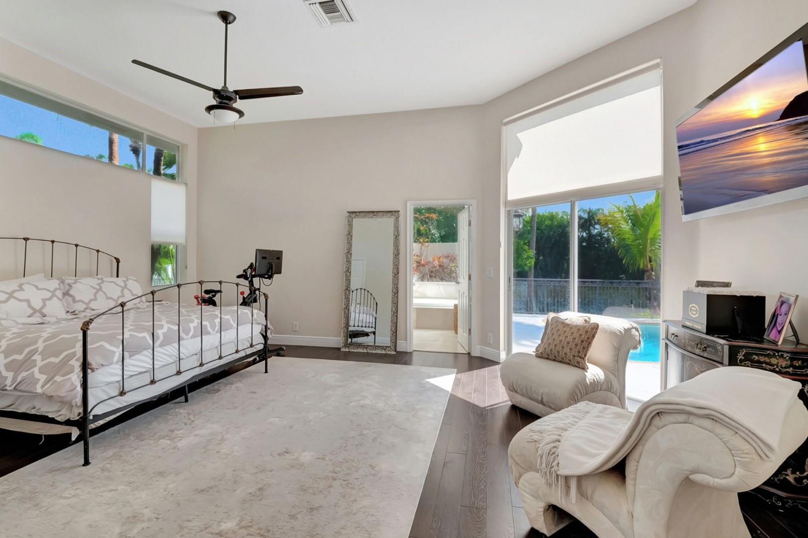 6096 Northwest 30th Way Boca Raton, FL 33496 - Photo 10 of 24 a bedroom with furniture and a large window