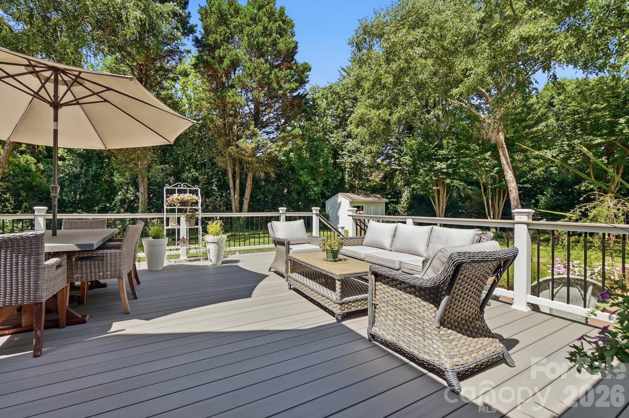 1136 Concord Road Davidson, NC 28036 - Photo 23 of 34 an outdoor sitting area with furniture and wooden floor
