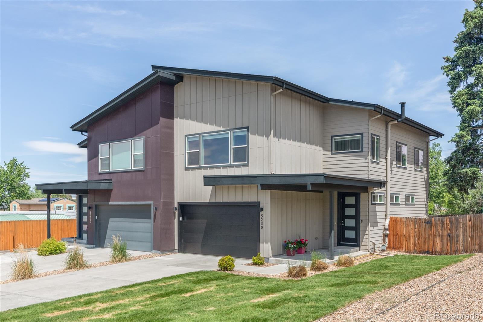 5230 Stuart Street Denver, CO 80212 - Photo 3 of 34 a front view of a house with a yard and a garage